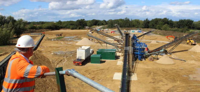 Site manager overlooking newly set up quarry at Cerney Wick