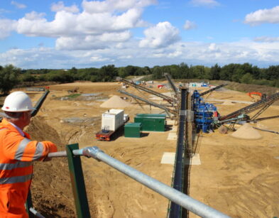 Site manager overlooking newly set up quarry at Cerney Wick