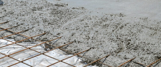 Wet concrete poured over steels rebars
