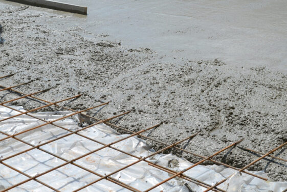 Wet concrete poured over steels rebars